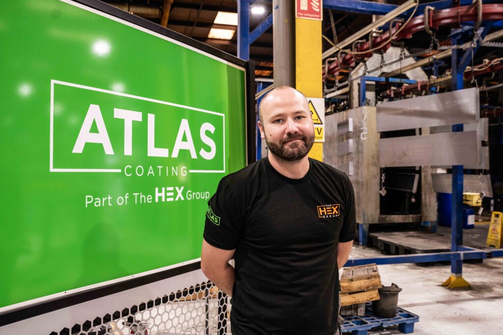 Mark Proctor, stood near the Atlas Coatings paint line.